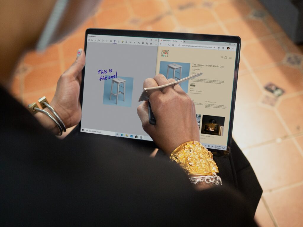 person using Surface computer on table